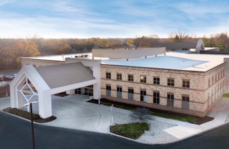 The Greenfield office building and covered entrance at 300 East Boyd Avenue