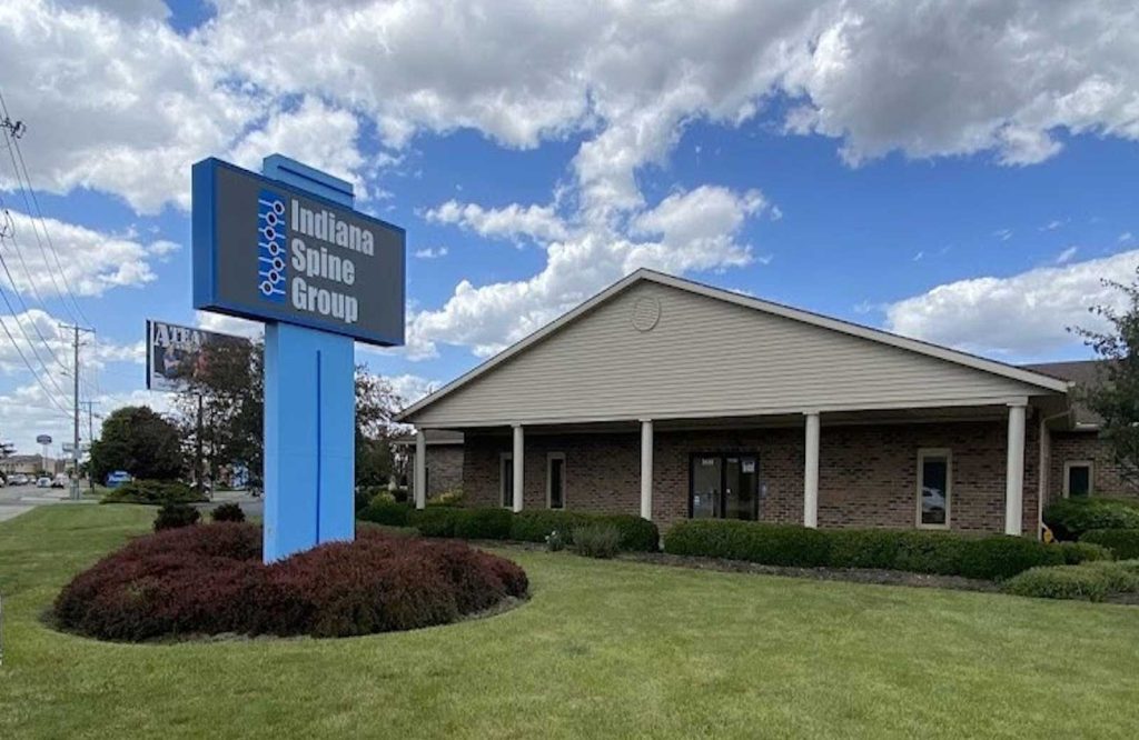 The Muncie office building and Indiana Spine Group sign at 3620 West Bethel Avenue